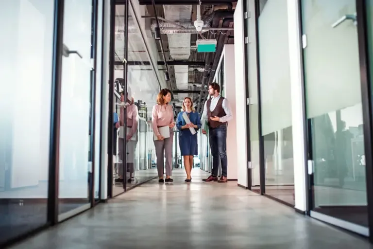 General Liability Office Hallway of Employees Standing and Chatting 768x512 2 General Liability Insurance  