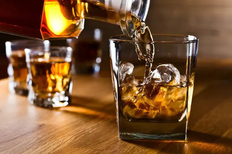Distillery Insurance Pouring Whiskey Into a Bar Glass with Fancy Ice Cubes 768x512 1 Distillery Insurance  