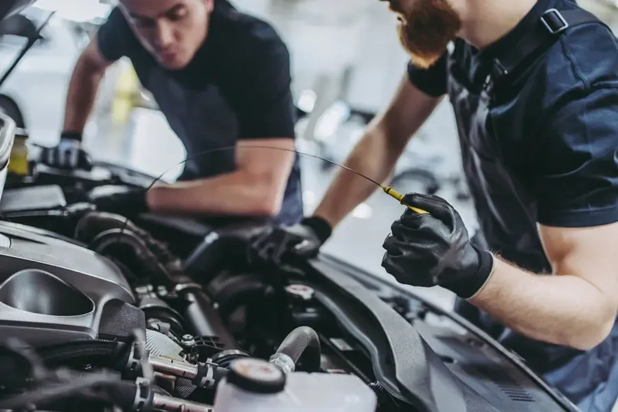 Garage Repair Shop Insurance Mechanics Changing Oil in the Car Garage Repair Shop Insurance Is your current insurance policy in need of a repair?