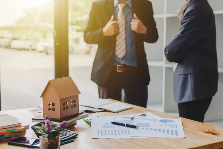 Real Estate Investor Insurance Investors Talking About a Recent Real Estate Deal 768x512 1 Real Estate Investor Insurance  
