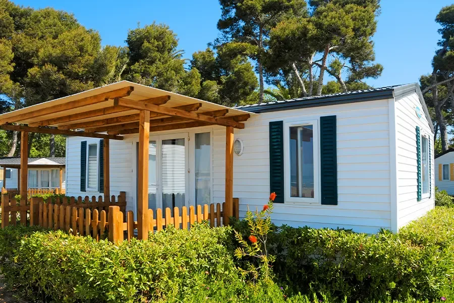 Mobile Home Park Insurance Closeup of Mobile Home with Covered Patio and Trees Mobile Home Insurance Special coverage for your mobile home.