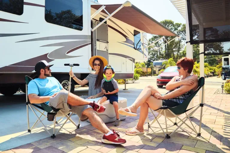 RV Insurance Family Camped Outside Talking About the Vacation 768x512 1 RV Insurance Coverage for your recreational vehicle.