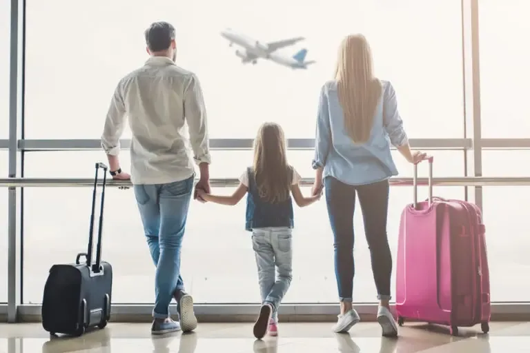 Travel Insurance Family Walking Through the Airport 768x512 1 Travel Insurance Peace of Mind while traveling internationally.